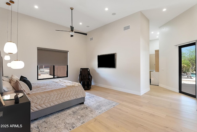 39419 N 7th Ave, Phoenix, AZ 85086 - bedroom with light wood-type flooring, a towering ceiling, baseboards, recessed lighting, and access to exterior