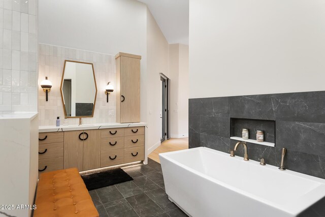 39419 N 7th Ave, Phoenix, AZ 85086 - bathroom featuring tile walls, a freestanding bath, and vanity