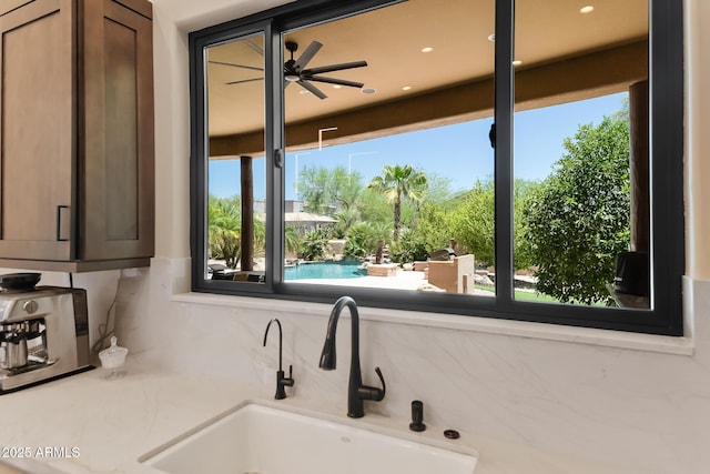 39419 N 7th Ave, Phoenix, AZ 85086 - kitchen view of a sink, a ceiling fan, decorative backsplash, and recessed lighting