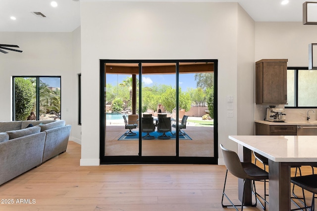 39419 N 7th Ave, Phoenix, AZ 85086 - dining area with a high ceiling, light wood-style flooring, recessed lighting, and baseboards