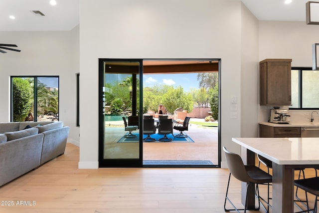 39419 N 7th Ave, Phoenix, AZ 85086 - dining room with a towering ceiling, light wood-type flooring, recessed lighting, baseboards, and ceiling fan