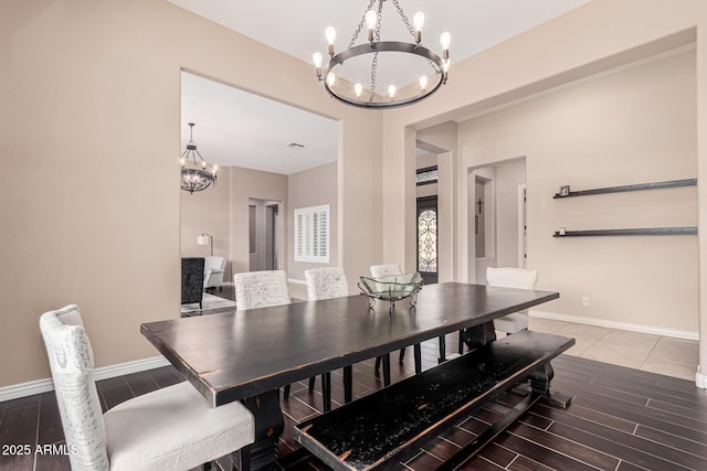 dining area featuring an inviting chandelier and wood-type flooring