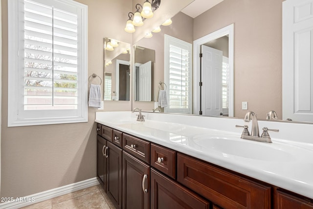 bathroom featuring tile patterned flooring and vanity