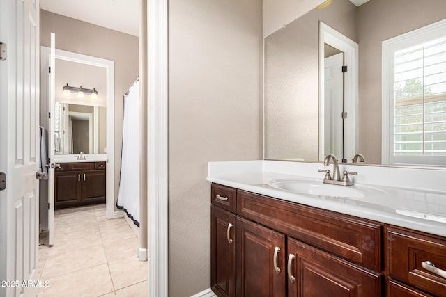 bathroom featuring vanity and tile patterned flooring