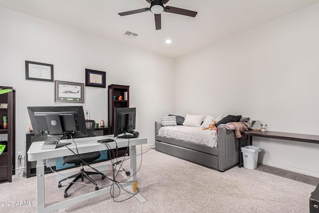 office space featuring light colored carpet and ceiling fan