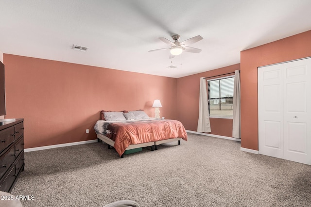 bedroom with baseboards, ceiling fan, visible vents, and carpet