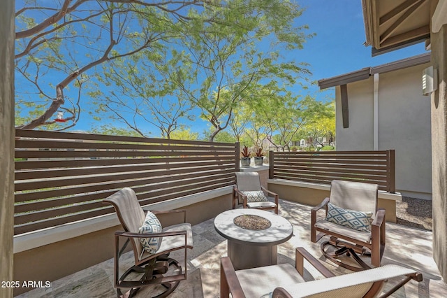 view of patio with an outdoor fire pit