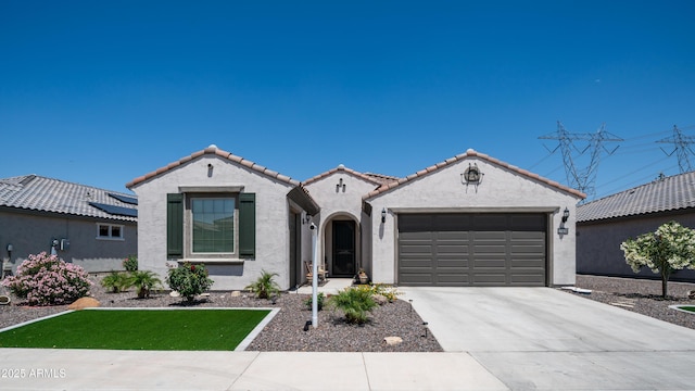 27636 W Runion Dr, Buckeye, AZ 85396 - mediterranean / spanish house featuring stucco siding, a garage, concrete driveway, and a tiled roof