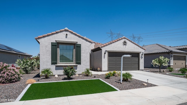 27636 W Runion Dr, Buckeye, AZ 85396 - mediterranean / spanish-style house featuring an attached garage, stucco siding, a tile roof, and concrete driveway