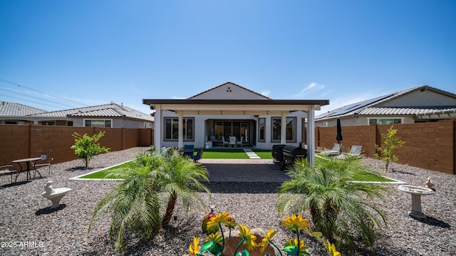 27636 W Runion Dr, Buckeye, AZ 85396 - back of house featuring a fenced backyard and a patio