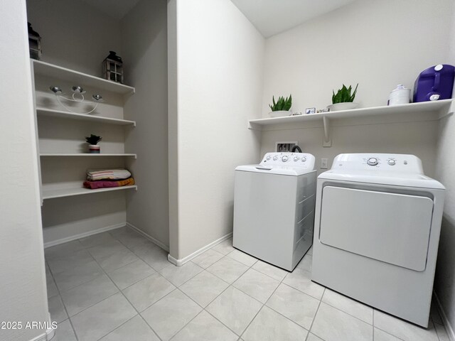 27636 W Runion Dr, Buckeye, AZ 85396 - laundry room with separate washer and dryer, light tile patterned floors, and baseboards