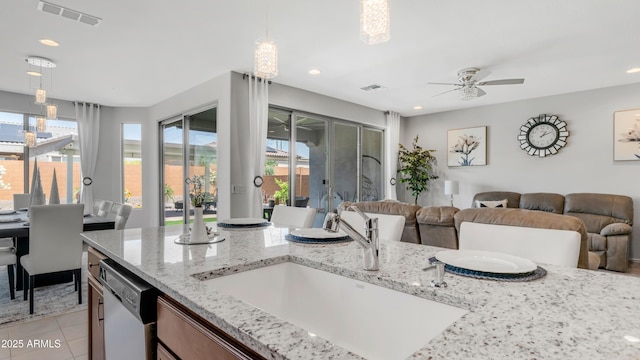 27636 W Runion Dr, Buckeye, AZ 85396 - kitchen with a sink, dishwasher, a ceiling fan, open floor plan, and decorative light fixtures