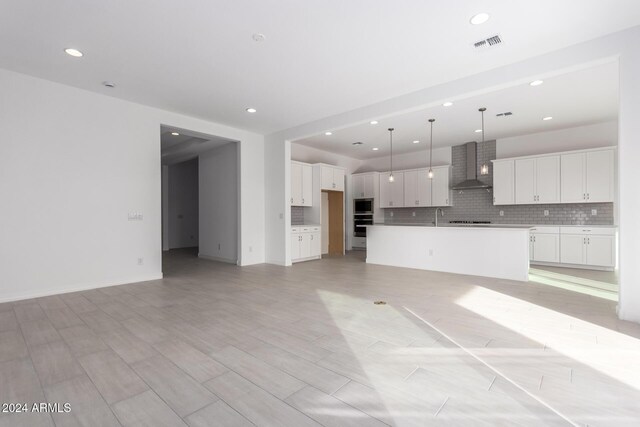 unfurnished living room with sink