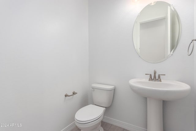 bathroom featuring sink and toilet