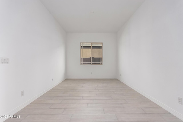 unfurnished room featuring light hardwood / wood-style floors