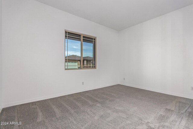 spare room featuring carpet flooring