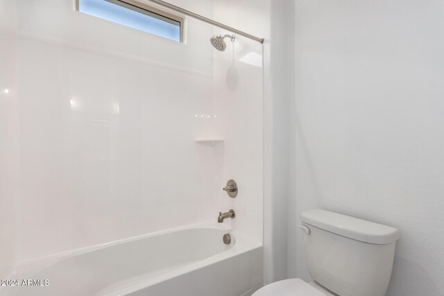 bathroom with toilet and shower / tub combination