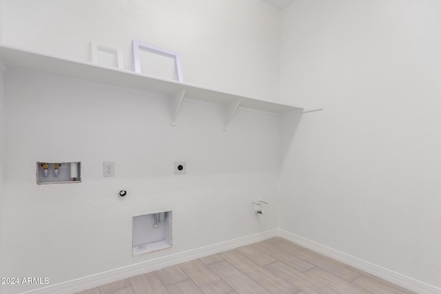 laundry room with light hardwood / wood-style floors, gas dryer hookup, hookup for a washing machine, and hookup for an electric dryer