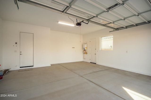 garage with tankless water heater and a garage door opener