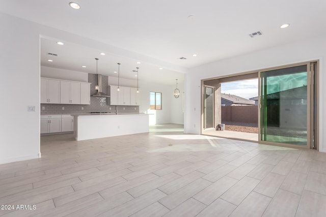 unfurnished living room with light wood-type flooring