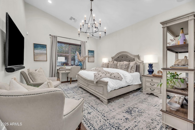 bedroom with vaulted ceiling, visible vents, and an inviting chandelier