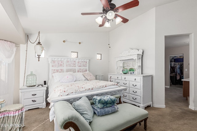 bedroom featuring light carpet, vaulted ceiling, and ceiling fan