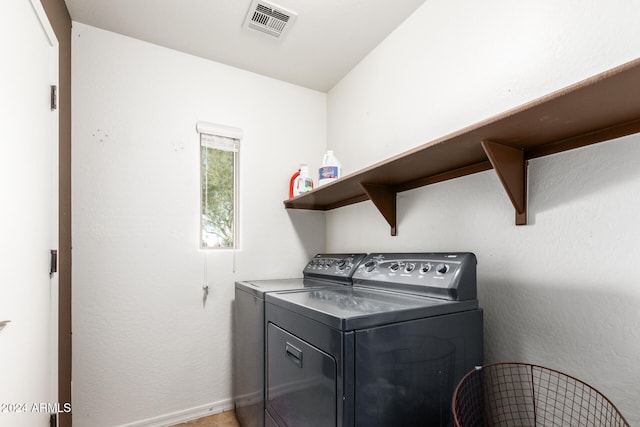 washroom featuring independent washer and dryer