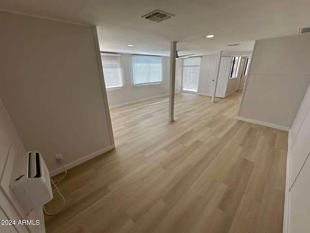 basement featuring light hardwood / wood-style floors