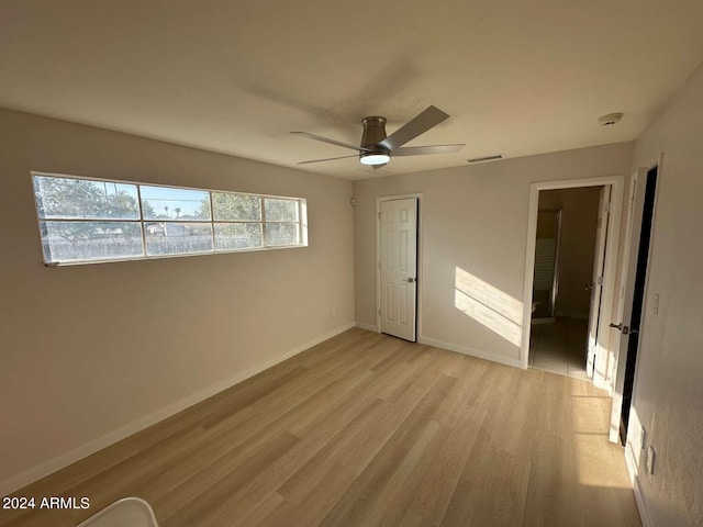 unfurnished bedroom featuring a closet, ceiling fan, and light hardwood / wood-style flooring