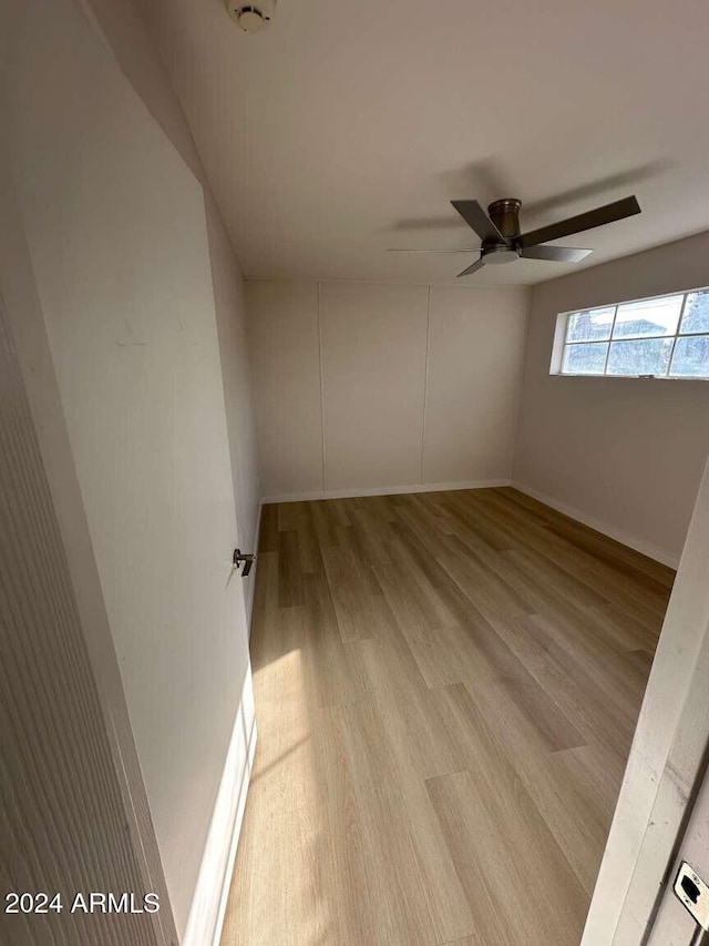 unfurnished room with light hardwood / wood-style floors and ceiling fan