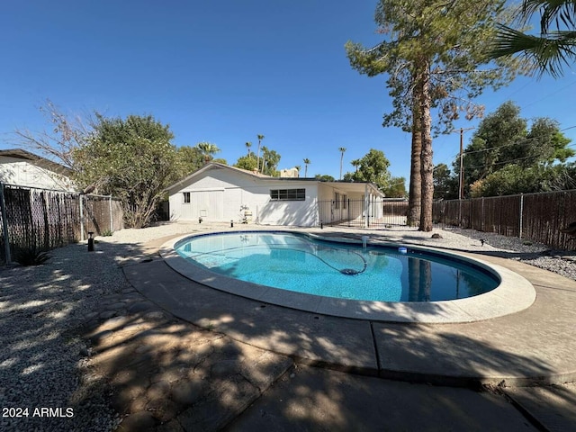 view of swimming pool with a patio