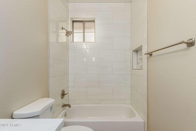 full bathroom featuring vanity, toilet, and tiled shower / bath