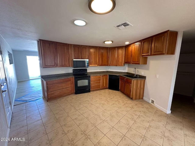 kitchen featuring black appliances and sink