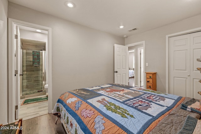 bedroom featuring tile flooring, connected bathroom, and a closet