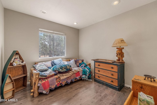 bedroom featuring hardwood / wood-style floors