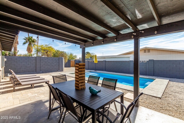 view of patio featuring a fenced in pool