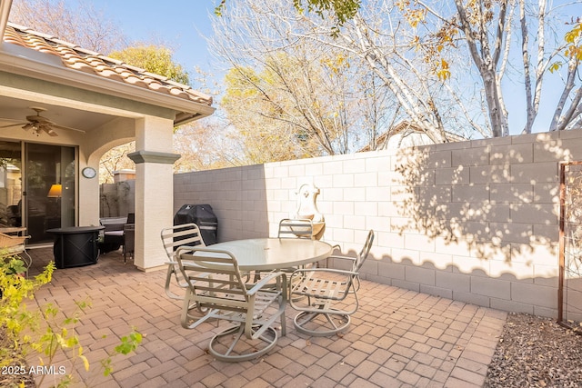 view of patio featuring ceiling fan and grilling area