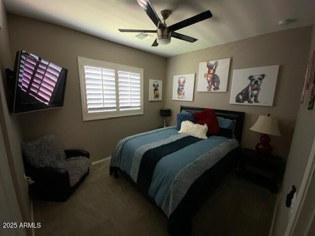 8587 N 171st Dr, Waddell, AZ 85355 - carpeted bedroom with ceiling fan and baseboards