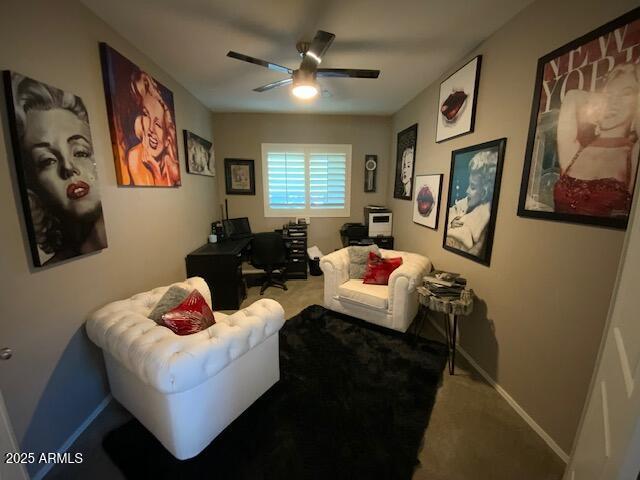 8587 N 171st Dr, Waddell, AZ 85355 - carpeted living area featuring ceiling fan and a desk