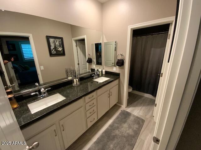 8587 N 171st Dr, Waddell, AZ 85355 - bathroom featuring double vanity and curtained shower