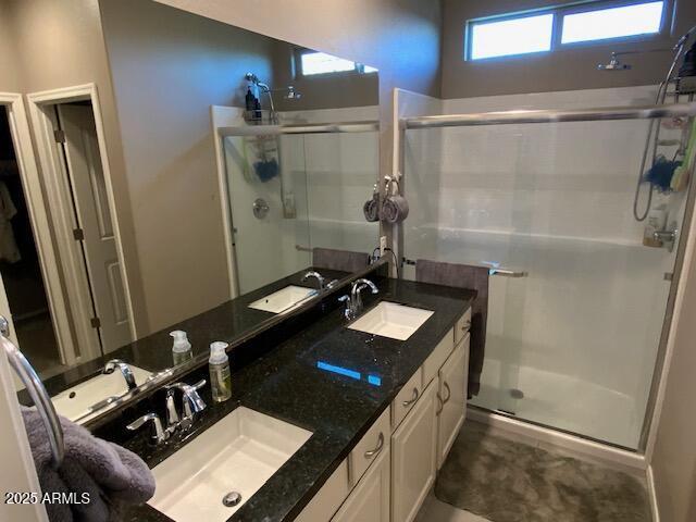 8587 N 171st Dr, Waddell, AZ 85355 - bathroom with a stall shower and double vanity