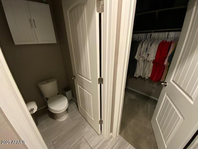 8587 N 171st Dr, Waddell, AZ 85355 - bathroom with toilet and baseboards