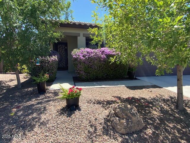 8587 N 171st Dr, Waddell, AZ 85355 - view of front of home featuring stucco siding and a tile roof