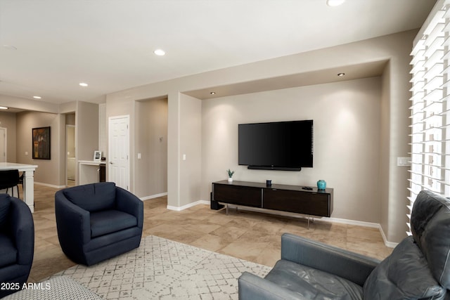 living room with recessed lighting and baseboards