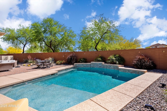 view of swimming pool with a fenced backyard, a fenced in pool, and a patio
