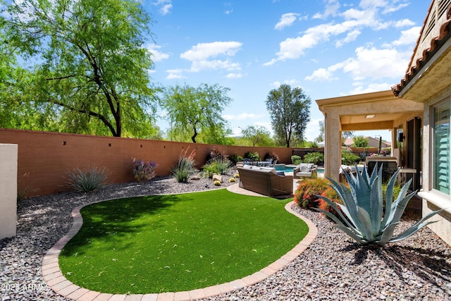 view of yard featuring a patio, outdoor lounge area, and a fenced backyard