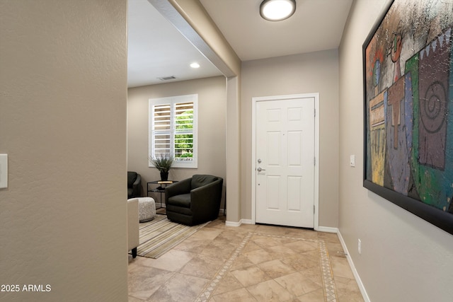 entryway with recessed lighting, visible vents, and baseboards