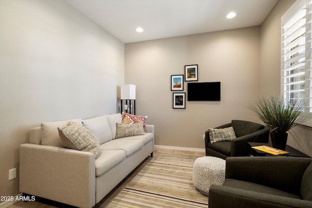 living room with recessed lighting and baseboards