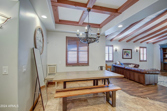 dining room with a notable chandelier, beamed ceiling, and wood-type flooring