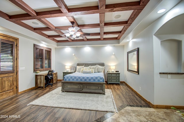 bedroom featuring dark hardwood / wood-style floors, beamed ceiling, coffered ceiling, and ceiling fan